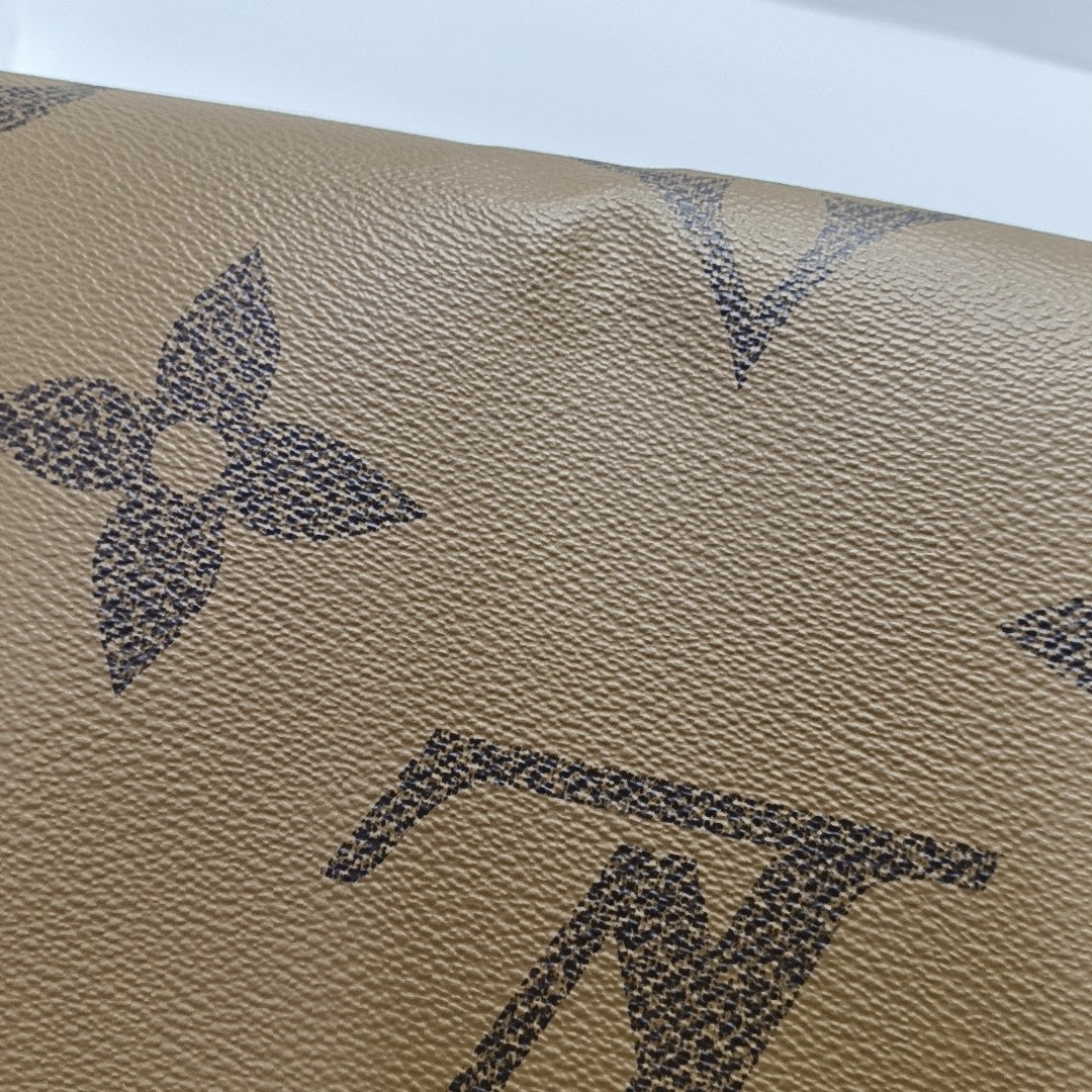 ONTHEGO MM Monogram Coated Canvas Brown
