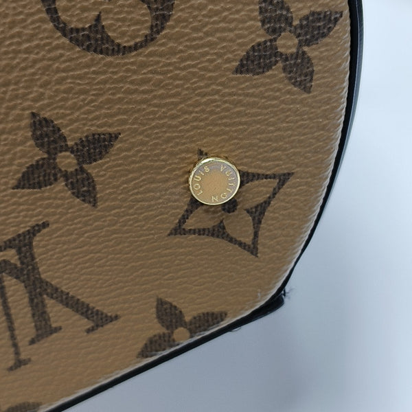CANNES PM Monogram Coated Canvas Brown