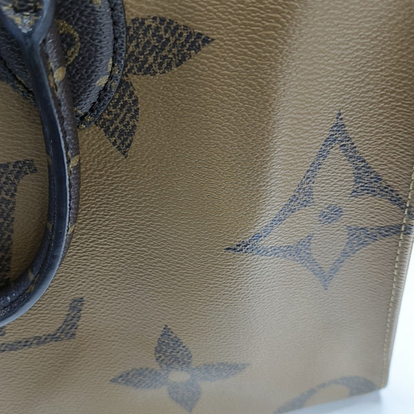 ONTHEGO MM Monogram Coated Canvas Brown