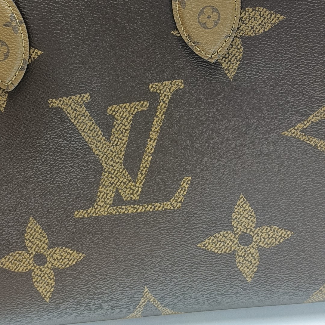 ONTHEGO MM Monogram Coated Canvas Brown