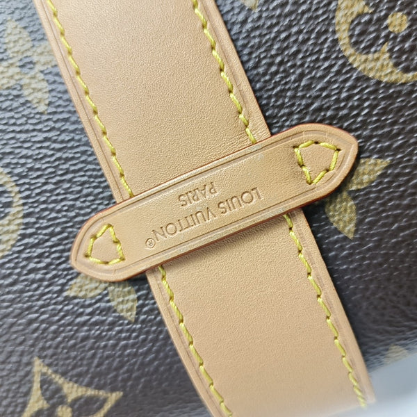 Pochette Mia Monogram Coated Canvas Brown