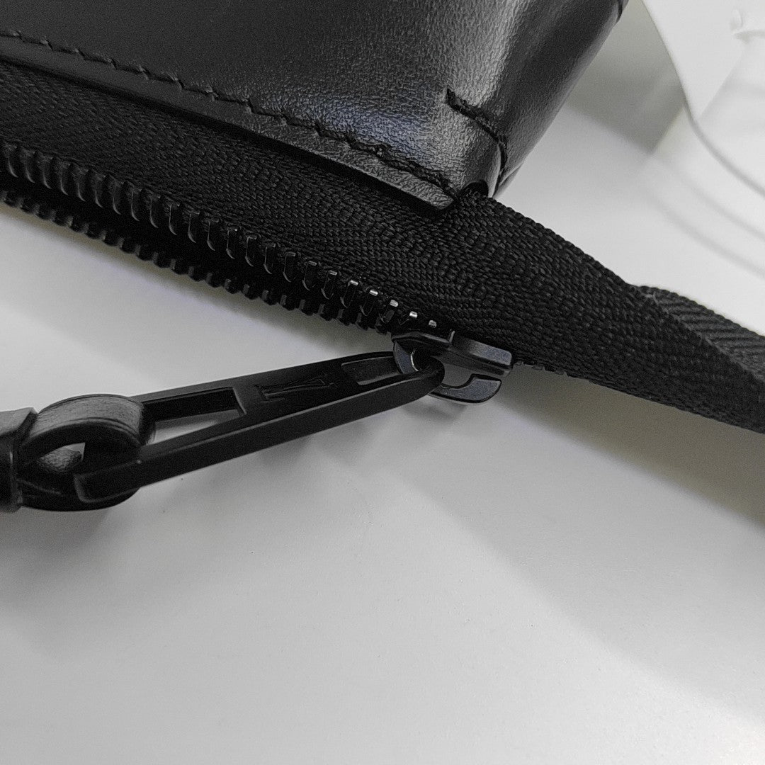Pochette Voyag Monogram Coated Canvas Black