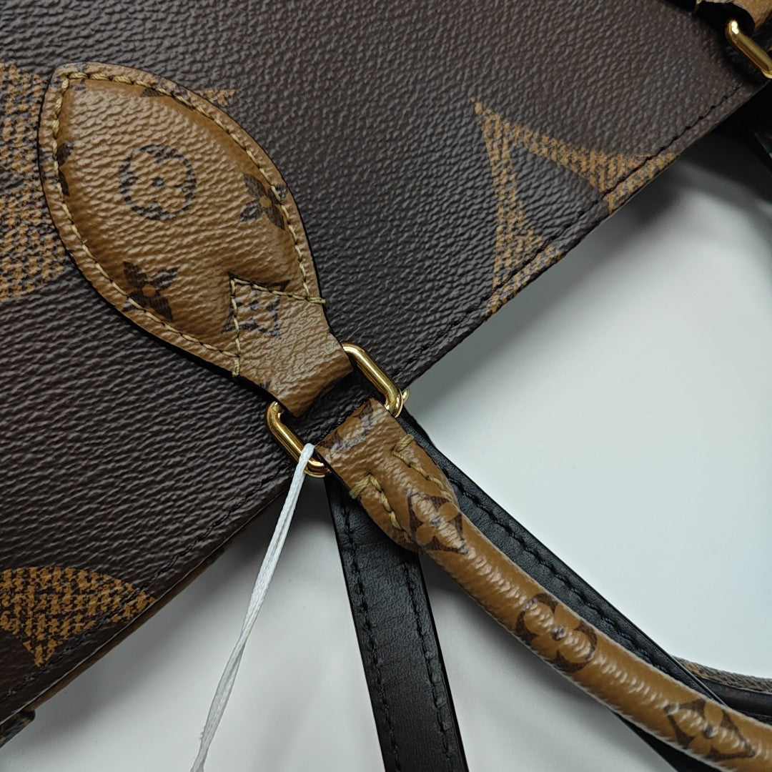 ONTHEGO MM Monogram Coated Canvas Brown