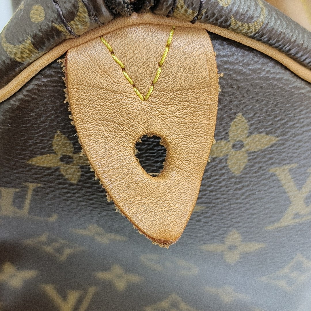 SPEEDY 25 Monogram Coated Canvas Brown