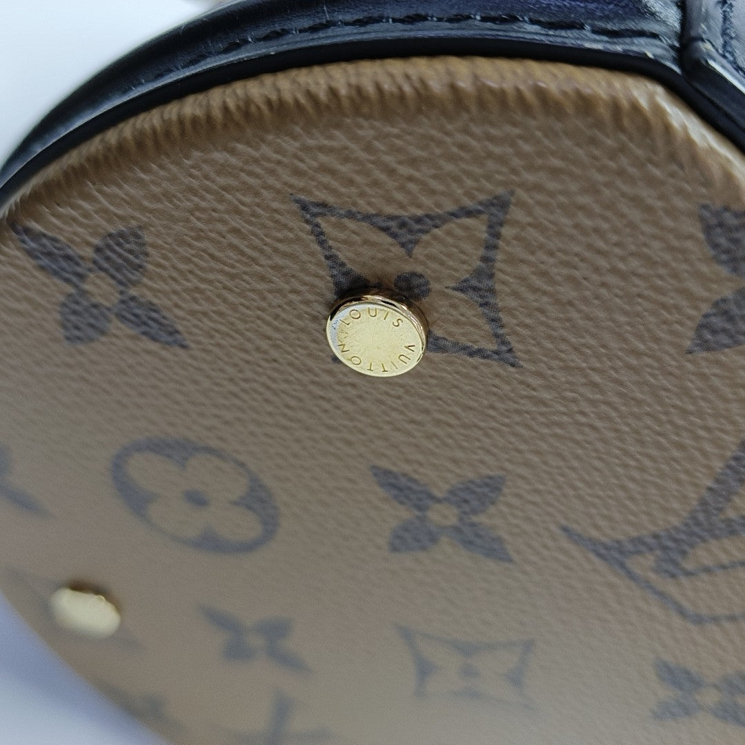 CANNES PM Monogram Coated Canvas Brown