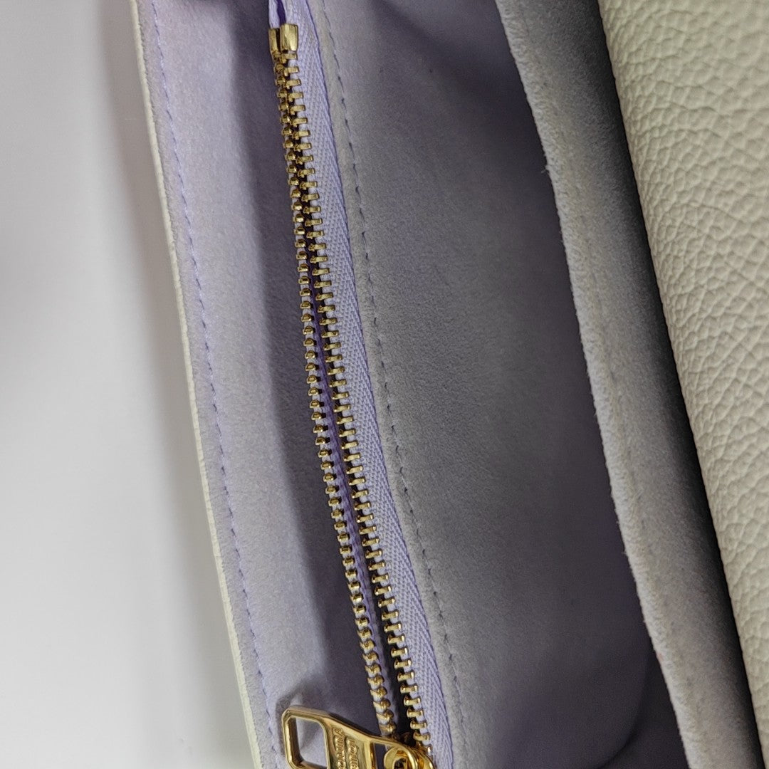 MÉTIS EAST WEST Monogram Calfskin White