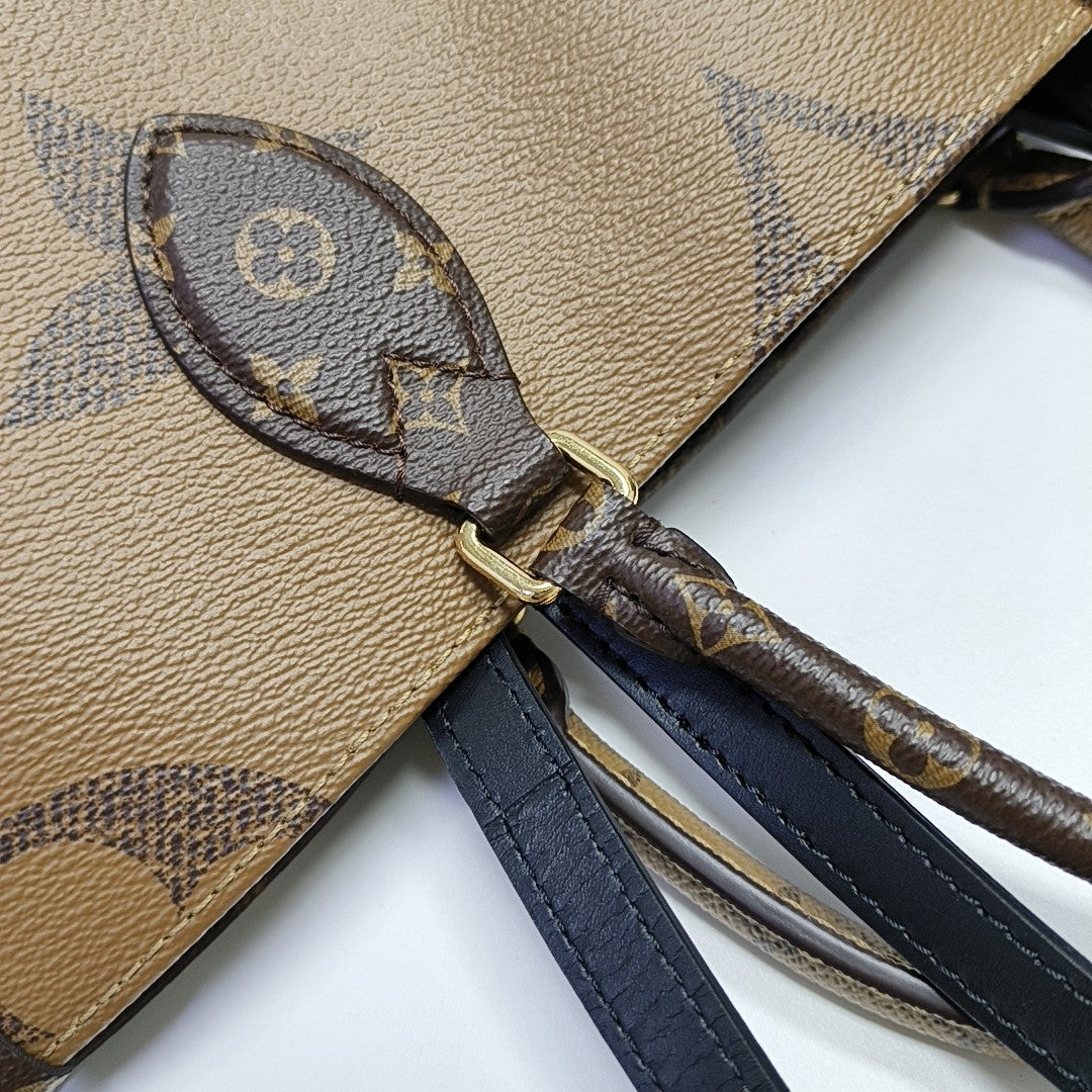 ONTHEGO MM Monogram Coated Canvas Brown