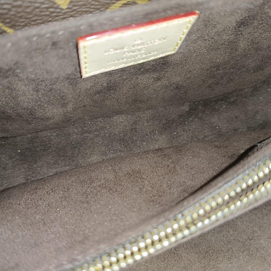 MÉTIS EAST WEST Monogram Coated Canvas Brown