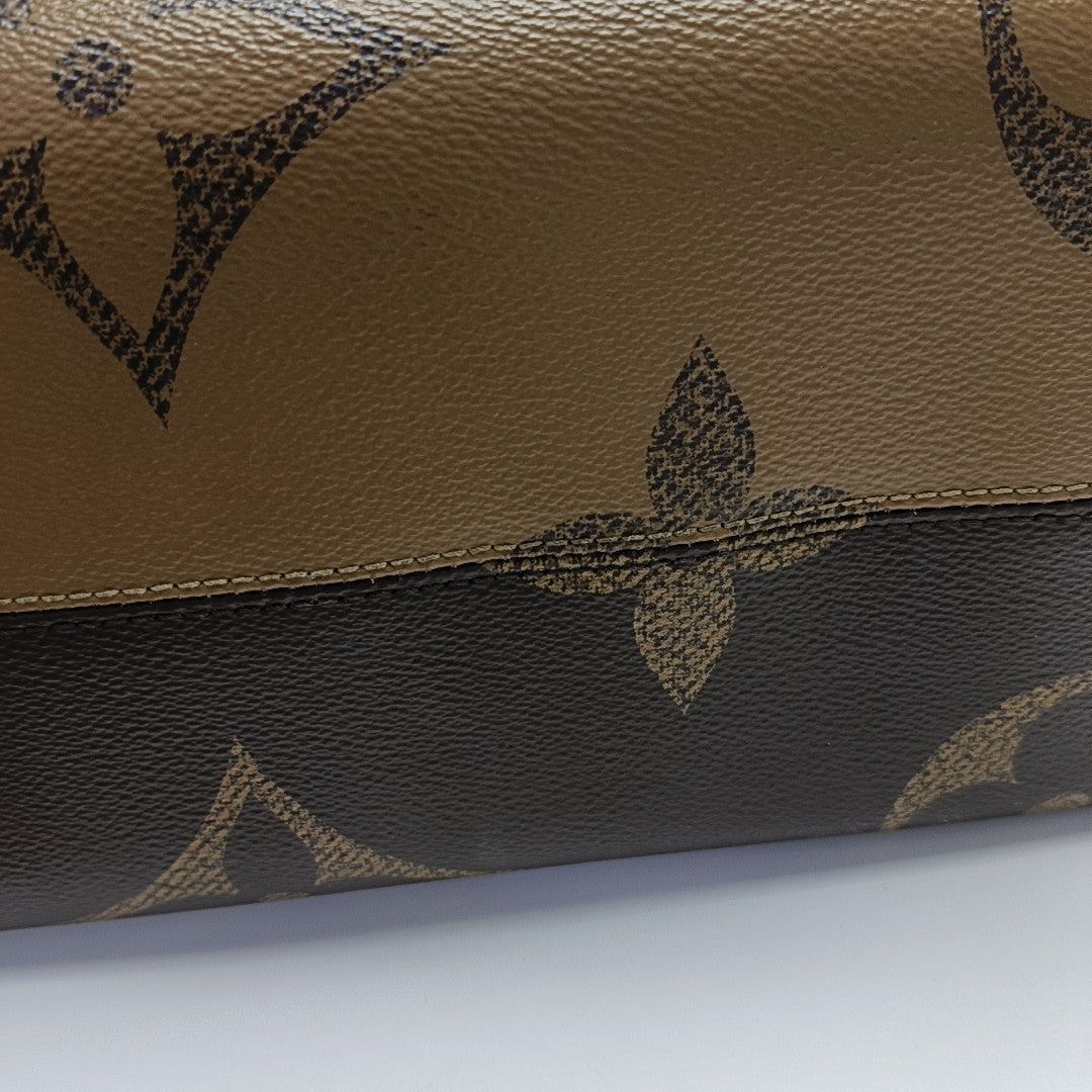 ONTHEGO MM Monogram Coated Canvas Brown
