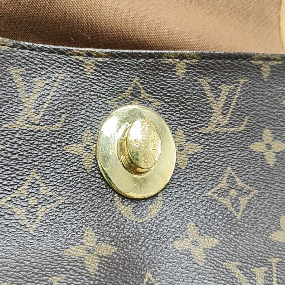 TIKAL Monogram Coated Canvas Brown
