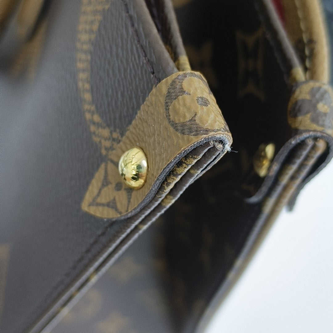 ONTHEGO MM Monogram Coated Canvas Brown