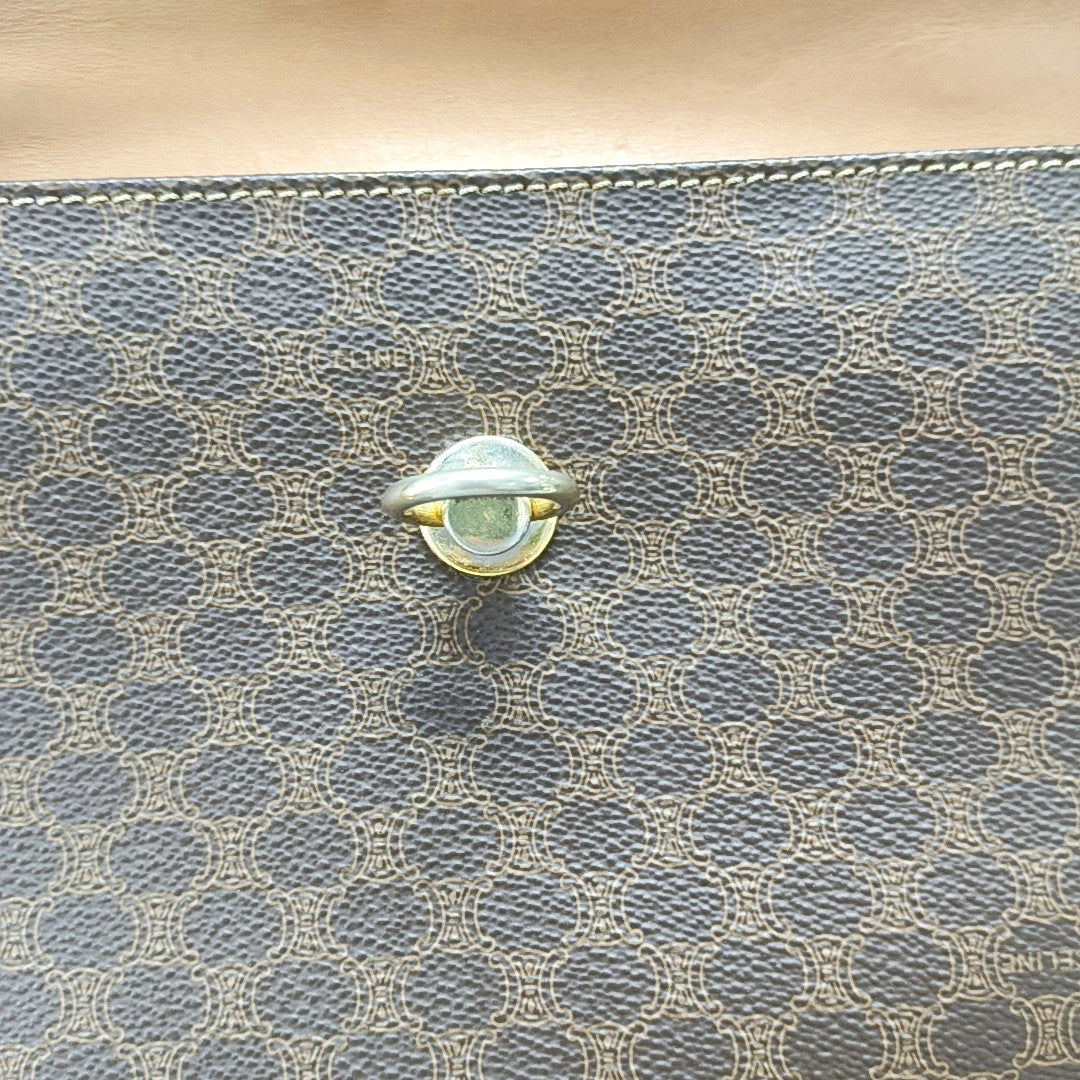 Authenticated pre-owned  MACADAM BLASON TRIOMPHE Coated Canvas Brown - Top Handle Bag at Looply