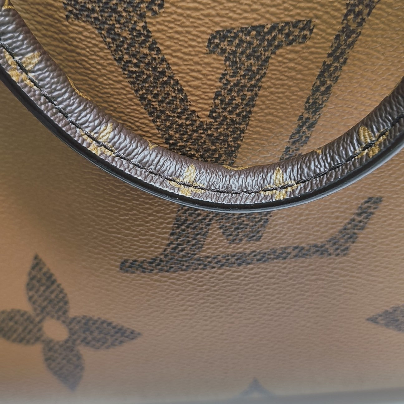 ONTHEGO MM Monogram Coated Canvas Brown