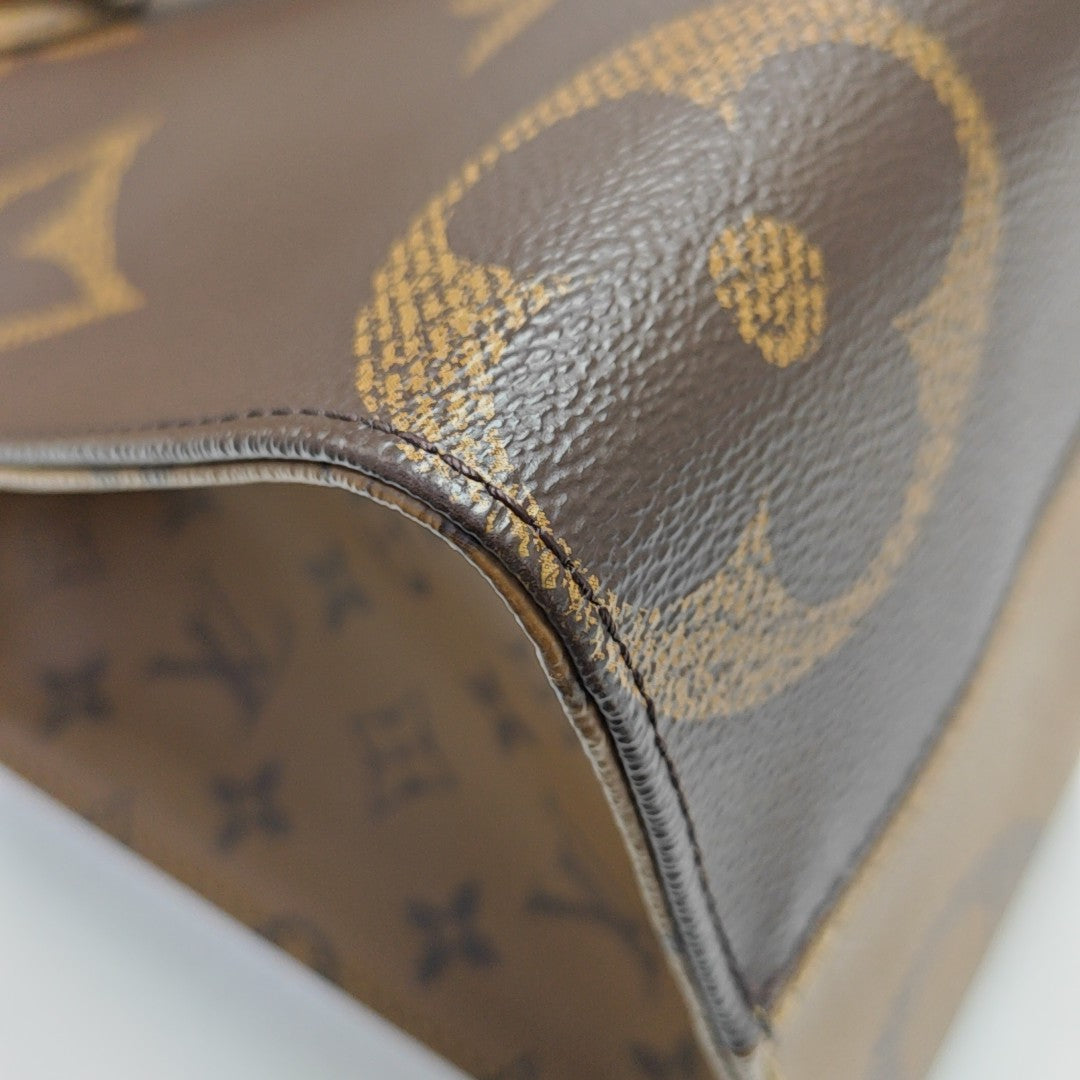 ONTHEGO MM Monogram Coated Canvas Brown