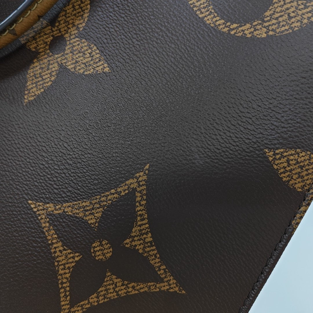 ONTHEGO GM Monogram Coated Canvas Brown