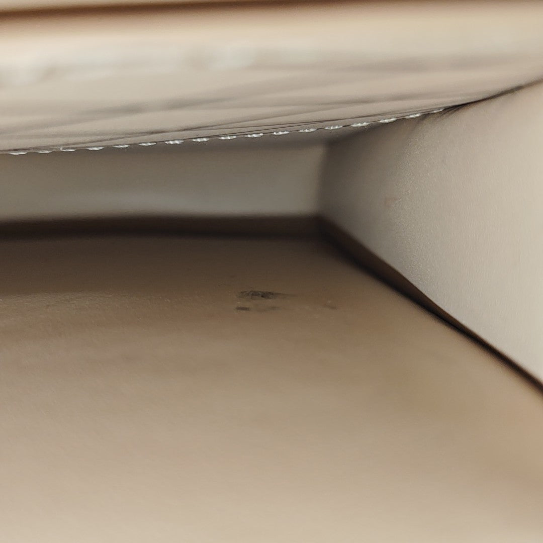 TRUNK Monogram Coated Canvas Brown