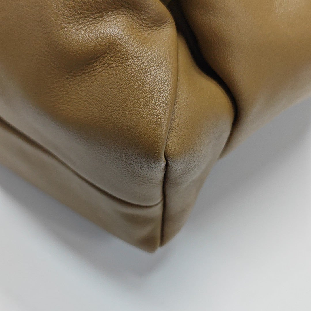 Authenticated pre-owned  The Pouch Calfskin Brown - Top Handle Bag at Looply