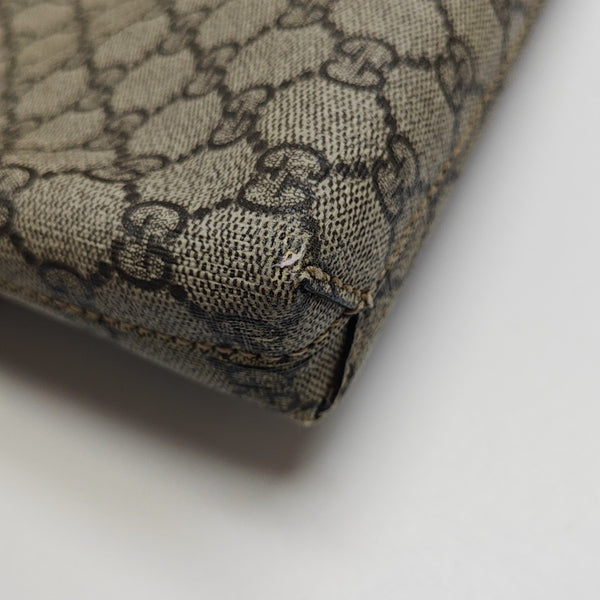 Monogram Coated Canvas Clutch Brown