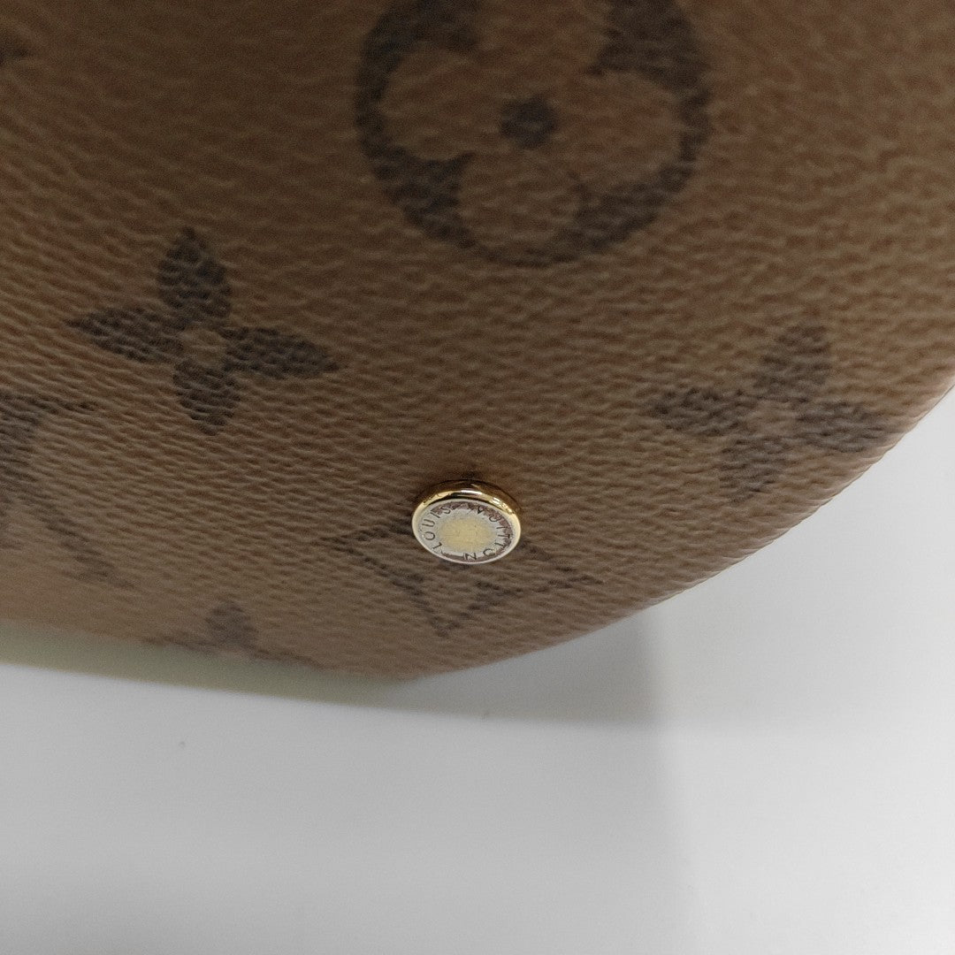 CANNES PM Monogram Coated Canvas Brown