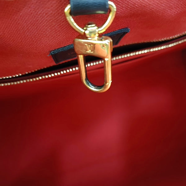 ONTHEGO MM Monogram Coated Canvas Brown
