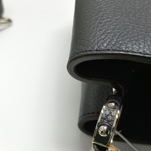 Authenticated pre-owned  CAPUCINES Calfskin Black - Top Handle Bag at Looply