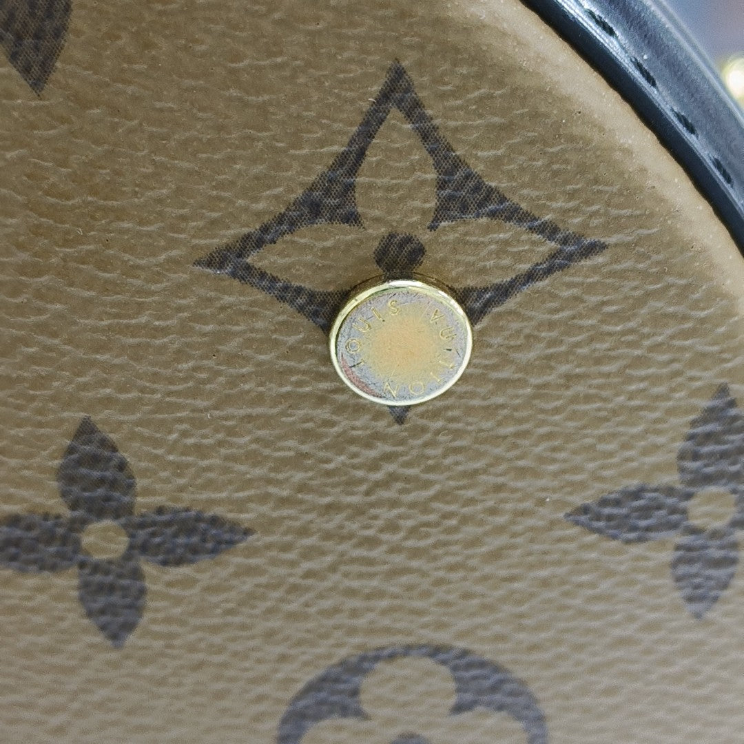 CANNES PM Monogram Coated Canvas Brown
