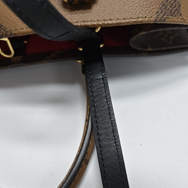 ONTHEGO MM Monogram Coated Canvas Brown