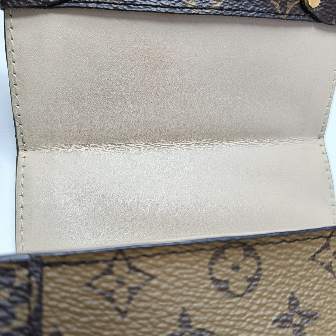 TRUNK Monogram Coated Canvas Brown