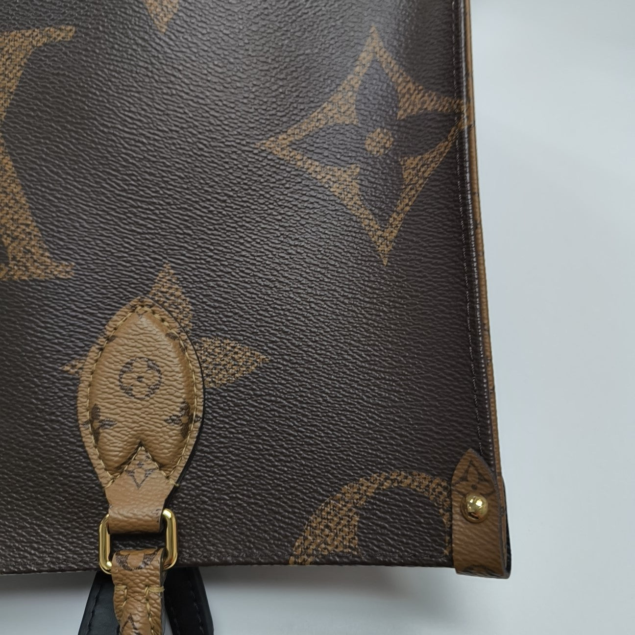 ONTHEGO MM Monogram Coated Canvas Brown