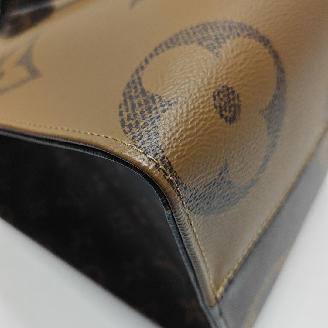 ONTHEGO MM Monogram Coated Canvas Brown