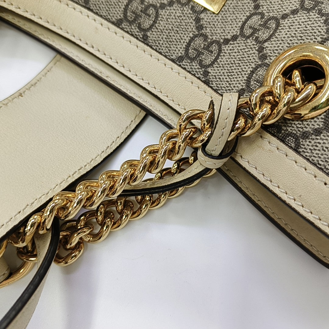 Padlock Small Monogram Coated Canvas Beige