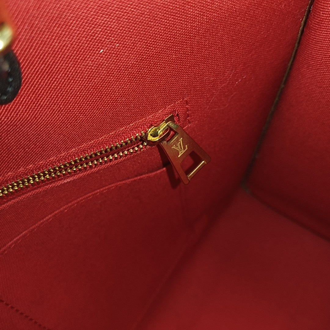 ONTHEGO MM Monogram Coated Canvas Brown
