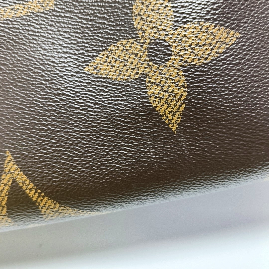 ONTHEGO MM Monogram Coated Canvas Brown