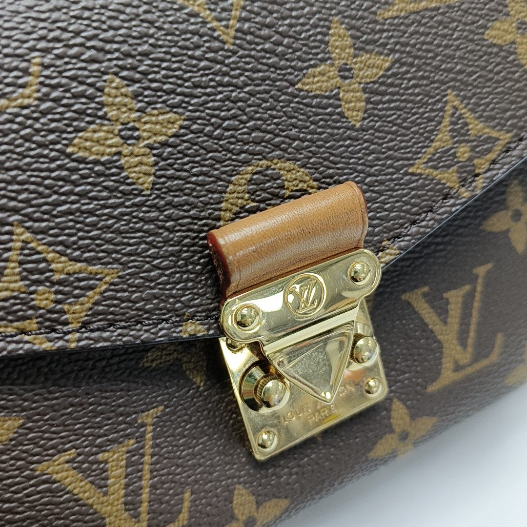 MÉTIS EAST WEST Monogram Coated Canvas Brown