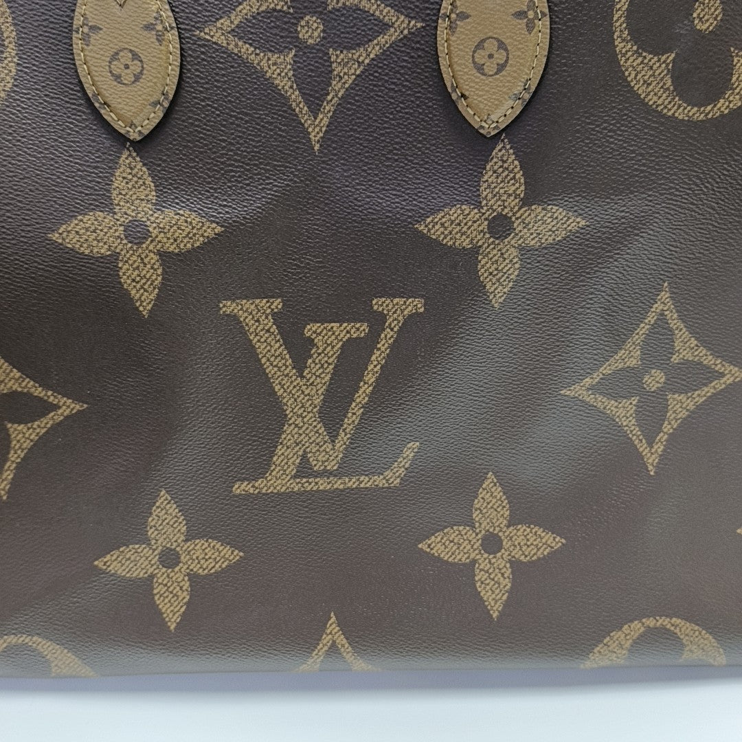 ONTHEGO GM Monogram Coated Canvas Brown
