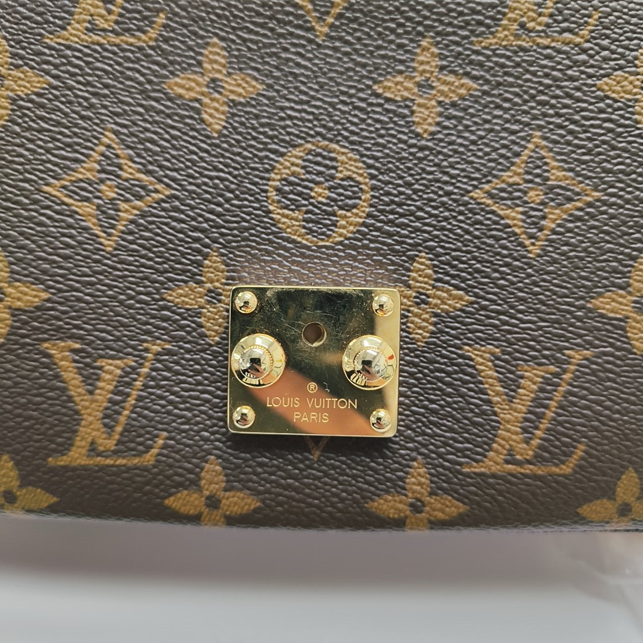 MÉTIS EAST WEST Monogram Coated Canvas Brown
