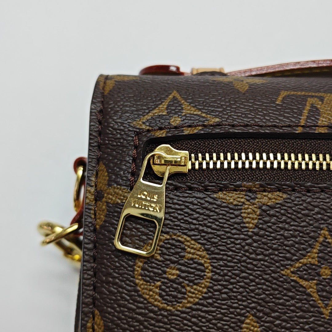 MÉTIS EAST WEST Monogram Coated Canvas Brown