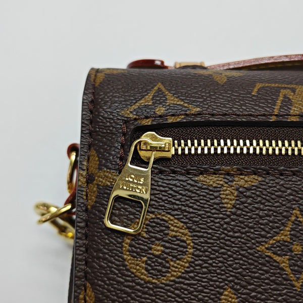 MÉTIS EAST WEST Monogram Coated Canvas Brown