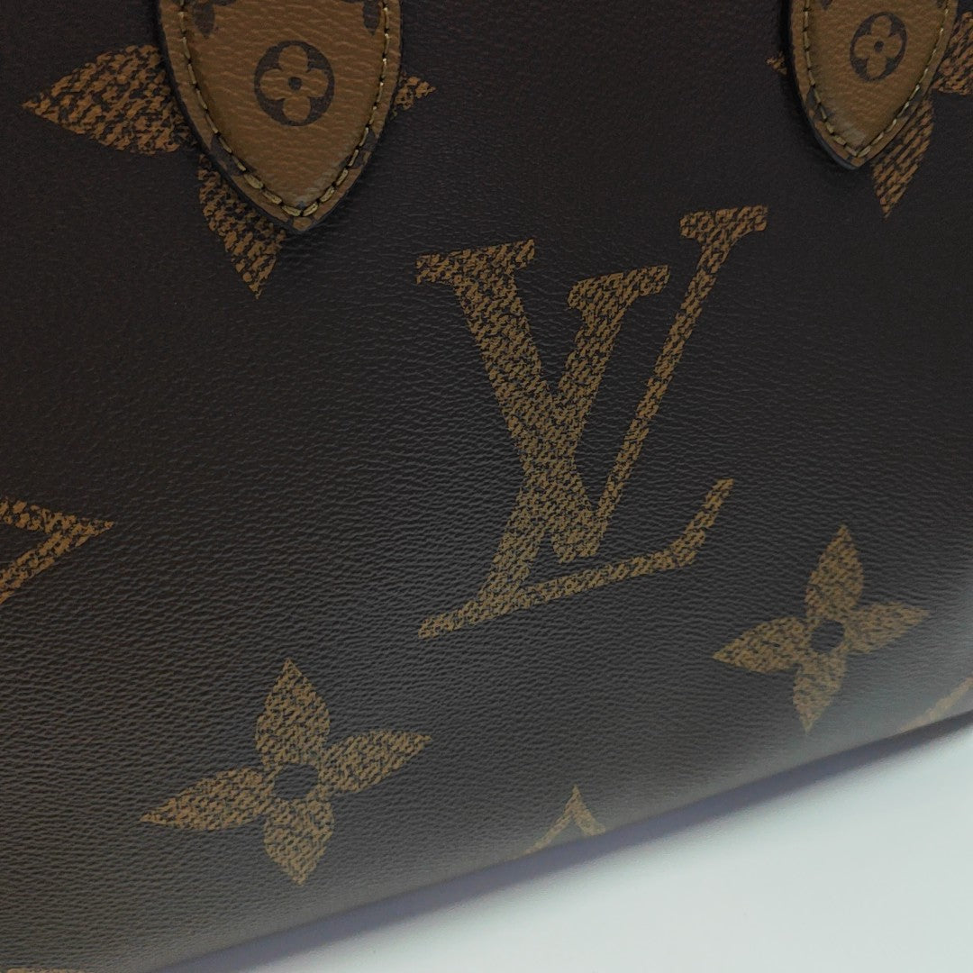 ONTHEGO MM Monogram Coated Canvas Brown