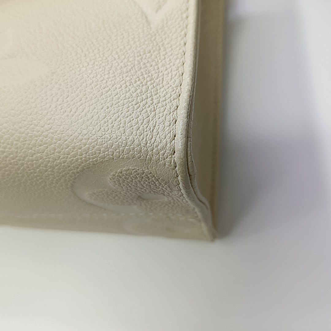 ONTHEGO PM Monogram Calfskin Beige