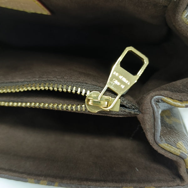 MÉTIS EAST WEST Monogram Coated Canvas Brown