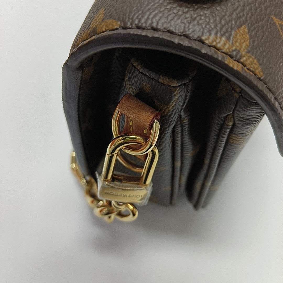 MÉTIS EAST WEST Monogram Coated Canvas Brown