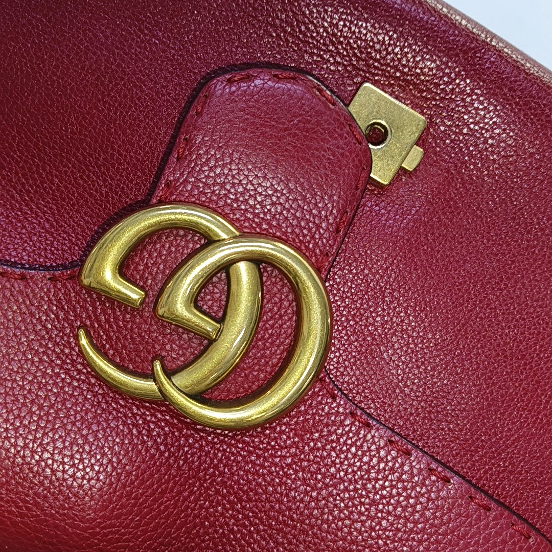 Authenticated pre-owned  GG Marmont Top Handle Small Calfskin Red - Shoulder Bag at Looply