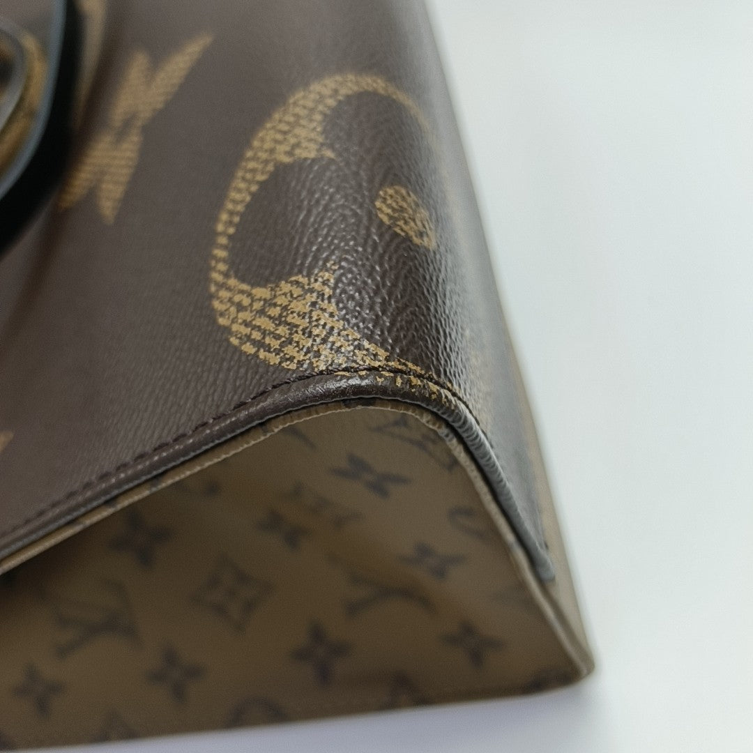 ONTHEGO MM Monogram Coated Canvas Brown