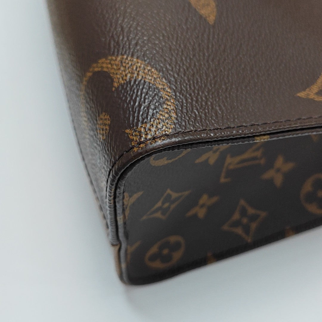 ONTHEGO PM Monogram Coated Canvas Brown