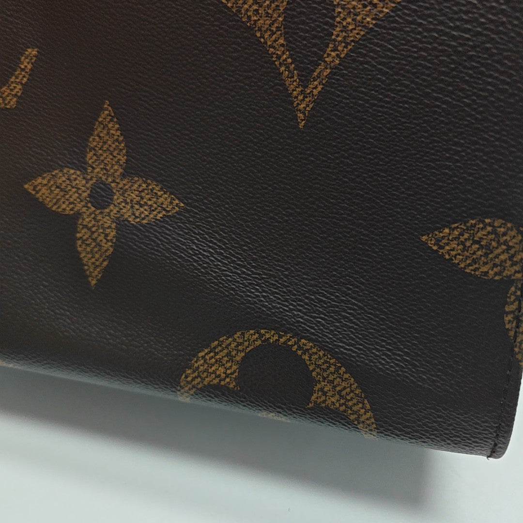 ONTHEGO GM Monogram Coated Canvas Brown
