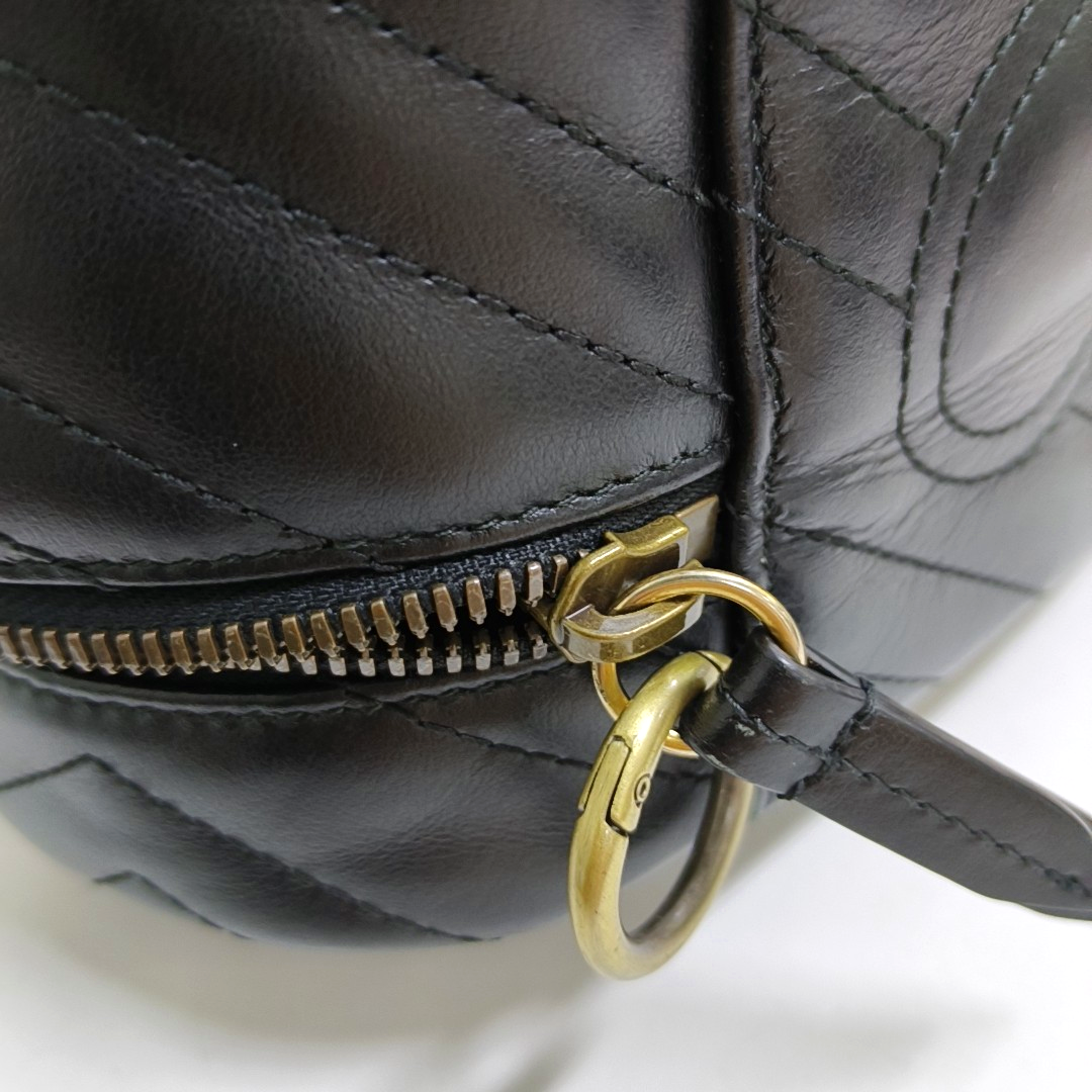 Authenticated pre-owned  GG Marmont Small Quilted Calfskin Black - Top Handle Bag at Looply