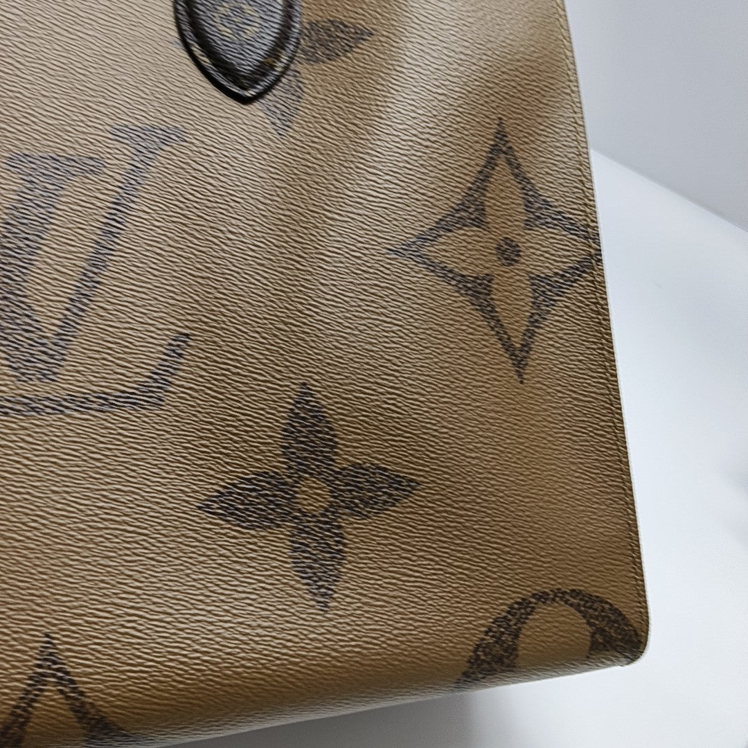 ONTHEGO MM Monogram Coated Canvas Brown