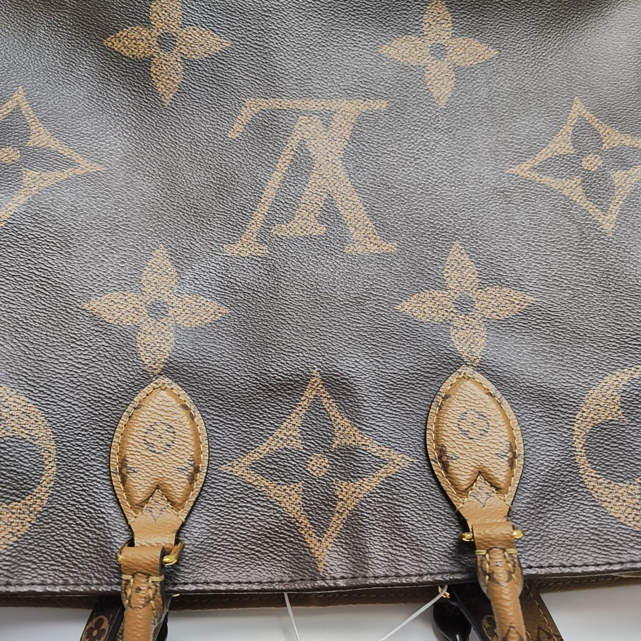 ONTHEGO GM Monogram Coated Canvas Brown