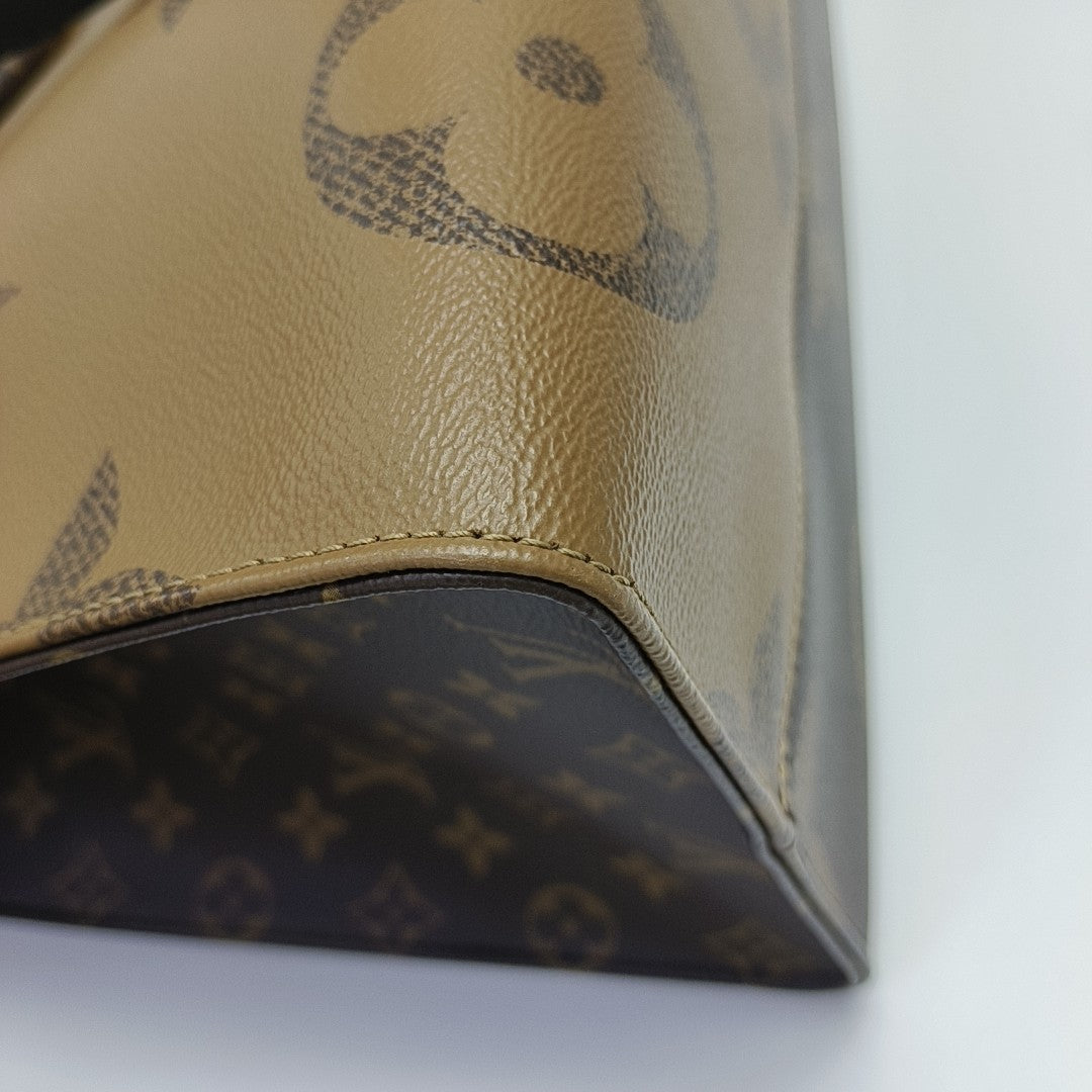 ONTHEGO GM Monogram Coated Canvas Brown